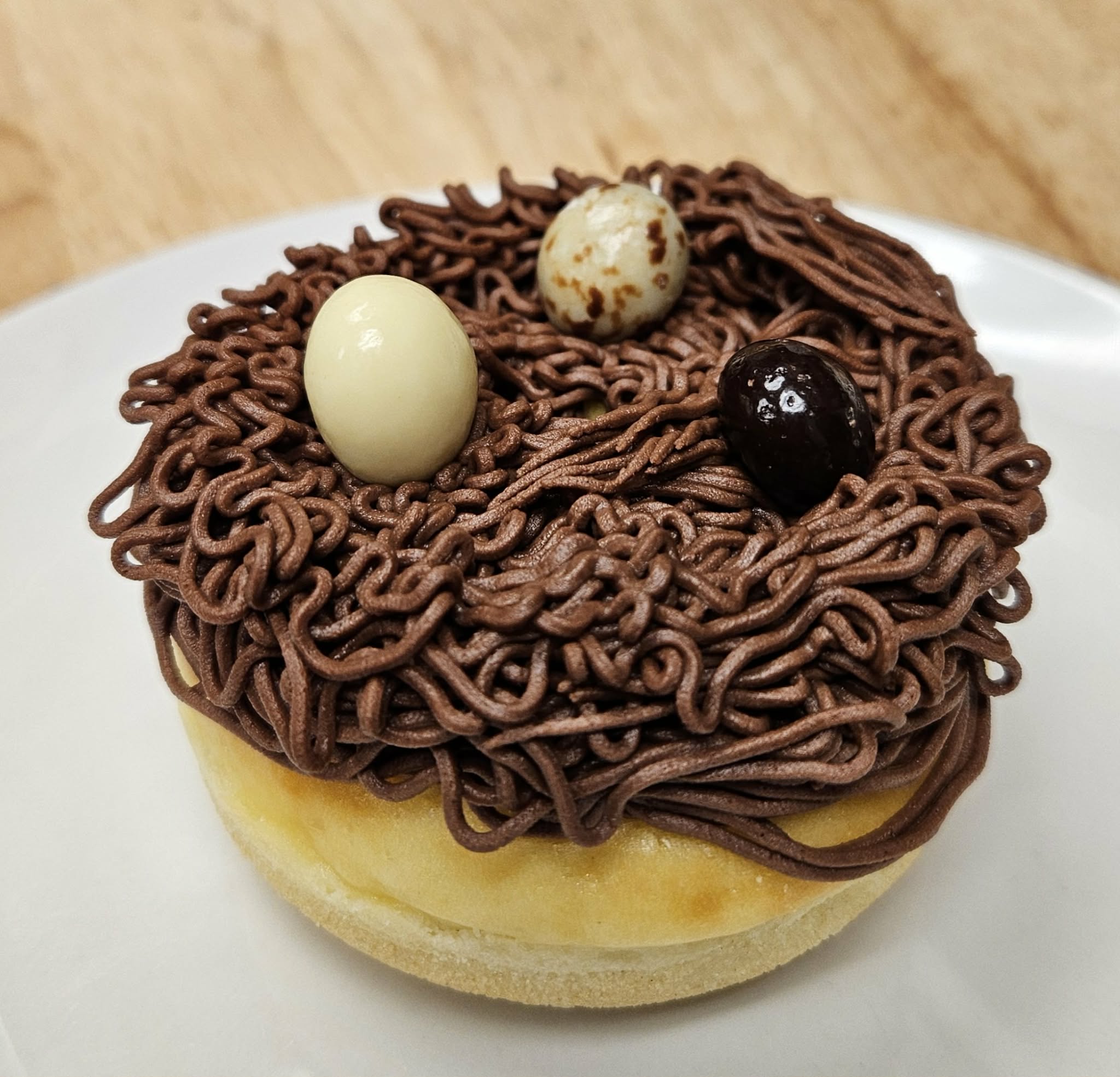 Eagle's Nest (baked donut, cheesecake, and cream cheese frosting, topped with 3 chocolate covered espresso beans)